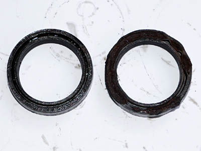 Degraded fork seals that caused oil leaks on motorcycle front forks