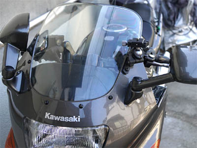 Motorcycle cowl with a camera pan head for mounting an action camera