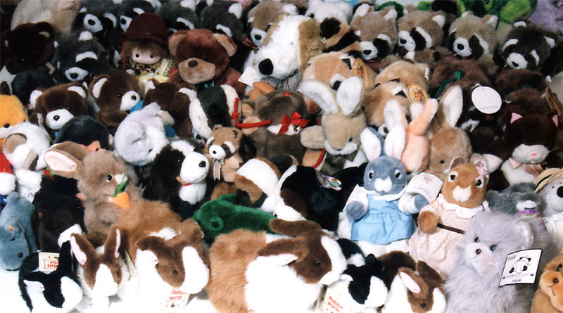 Stuffed animal of claw crane game piled up in the room